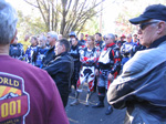 Paul Dean looks on as riders meeting gets underway.